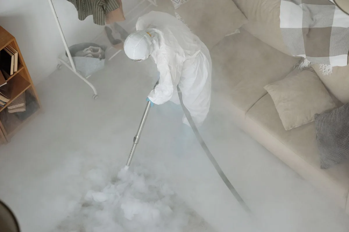 Biohazard cleanup technician in protective equipment, Kiel, WI